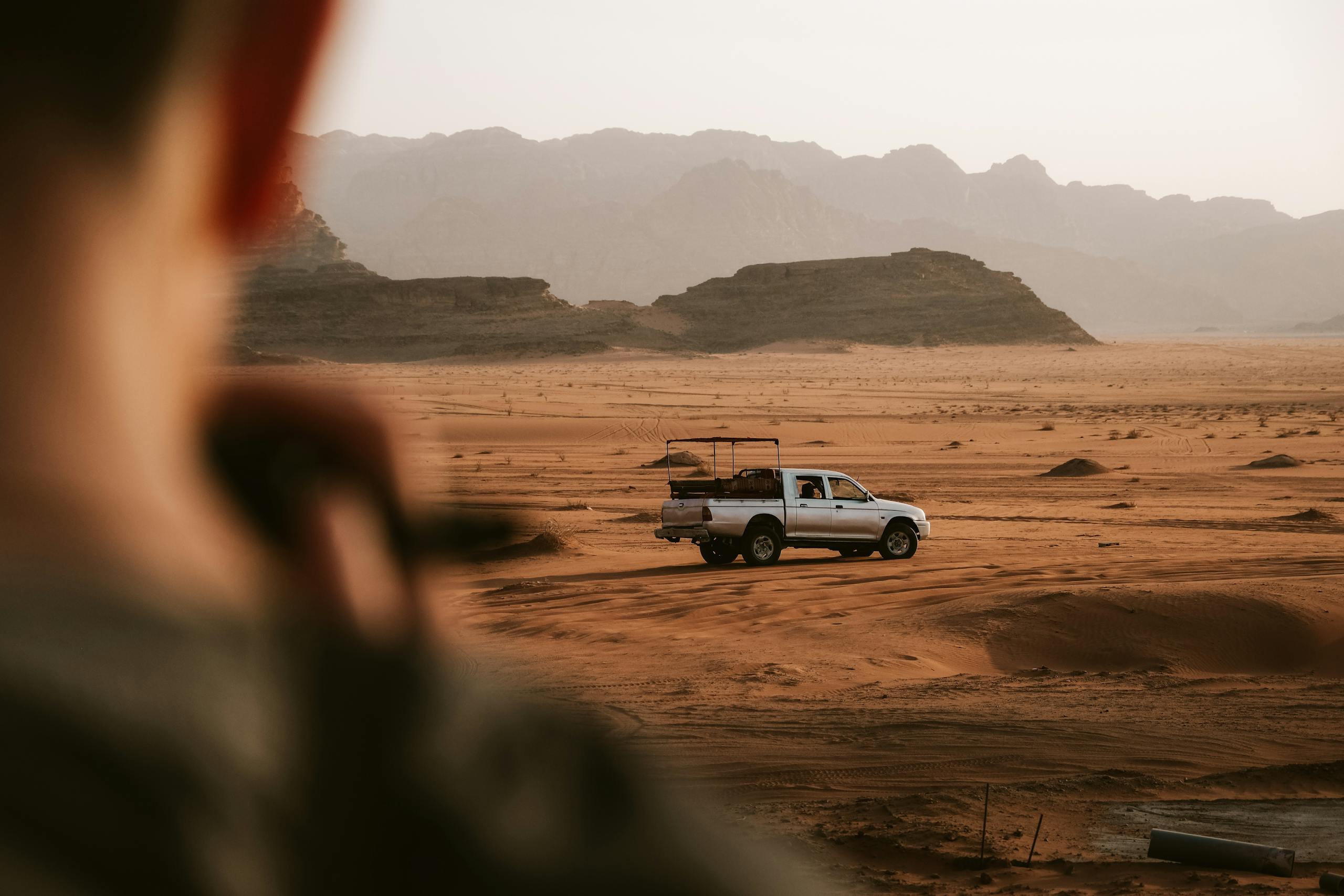 A scenic off-road vehicle journey through the beautiful Wadi Rum desert with stunning sandstone landscapes.